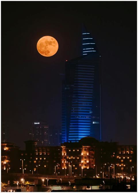 Stunning view of Dubai's skyline at night, featuri