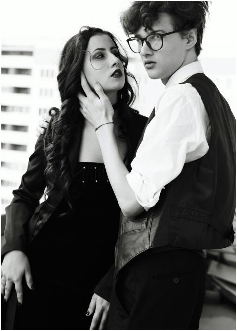 Fashion-forward young couple posing elegantly in a