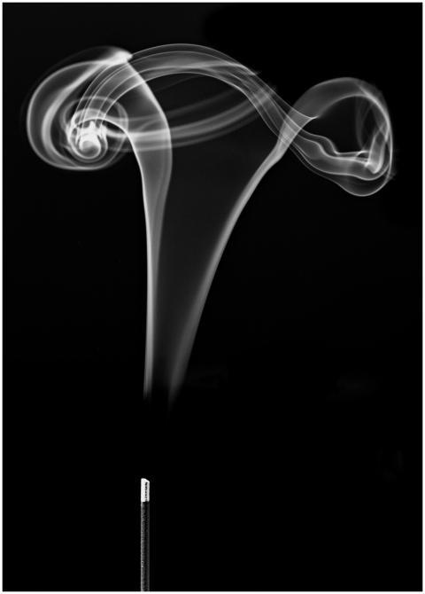 Black and white photo of swirling incense stick sm