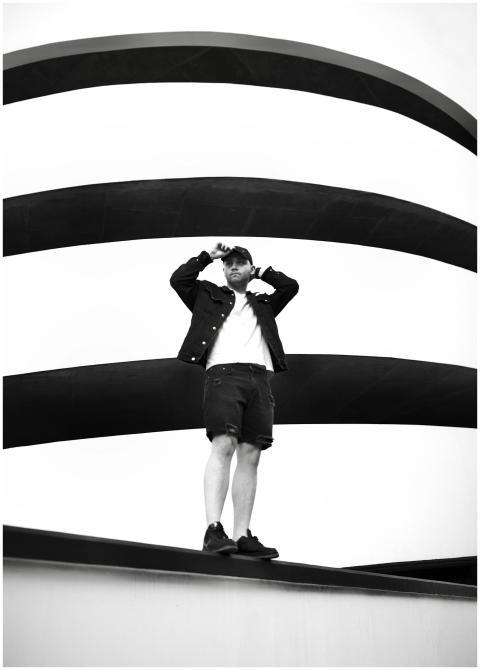 Stylish man in a black and white setting wearing c