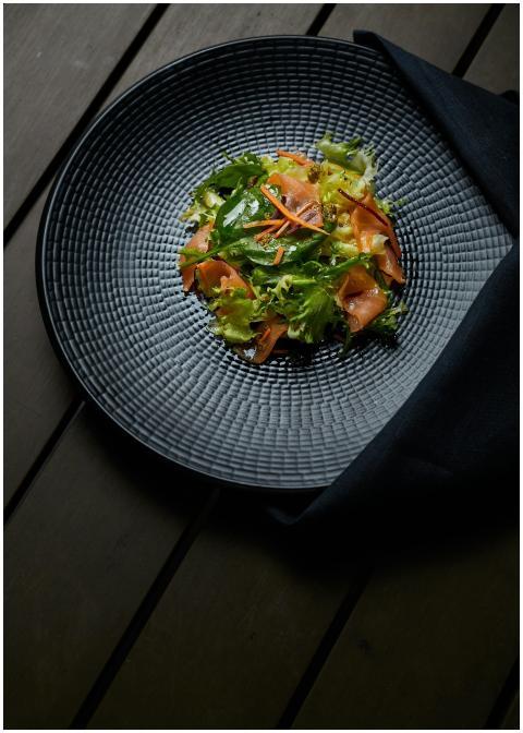 Vibrant vegetable salad served on a stylish black