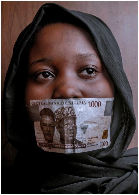 Portrait of a woman with Nigerian currency coverin