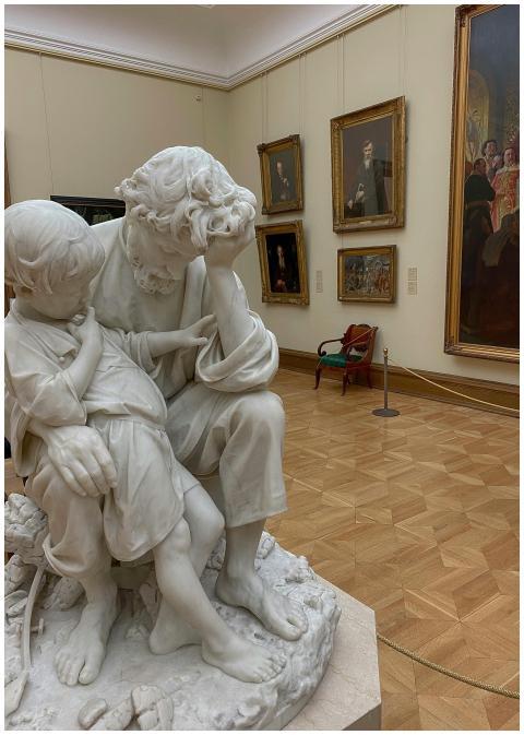 A detailed marble sculpture in an art gallery, sur