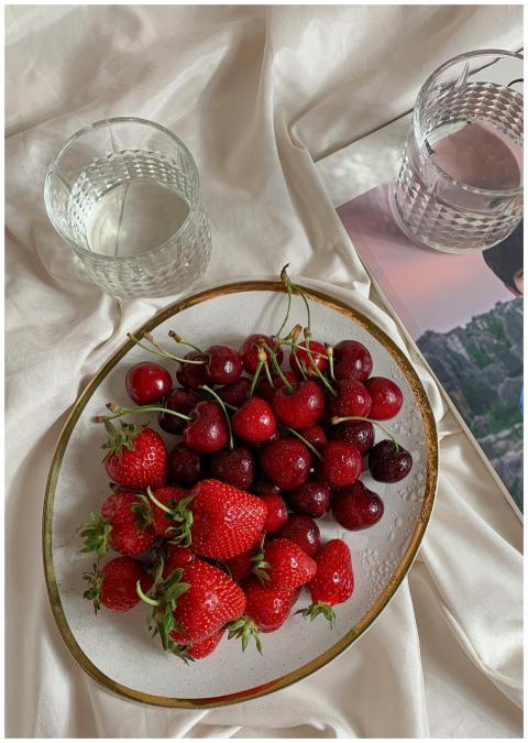 Delicious strawberries and cherries on a stylish p