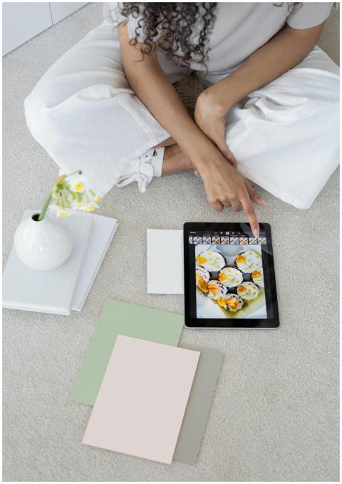 Young woman using a tablet in a modern, minimalist