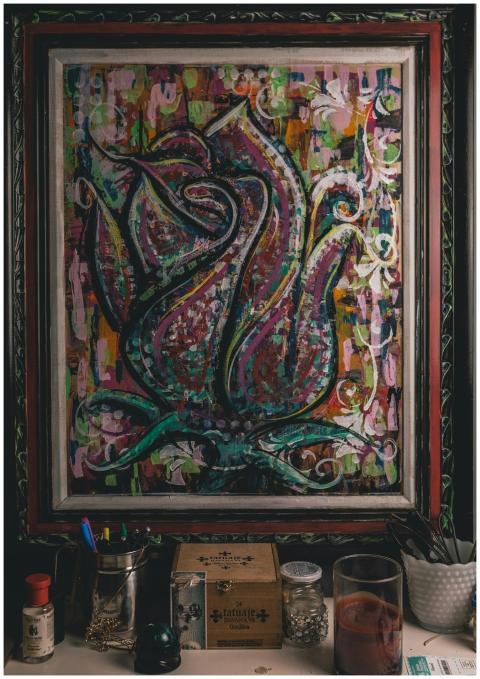 A vibrant multi-colored abstract floral painting i