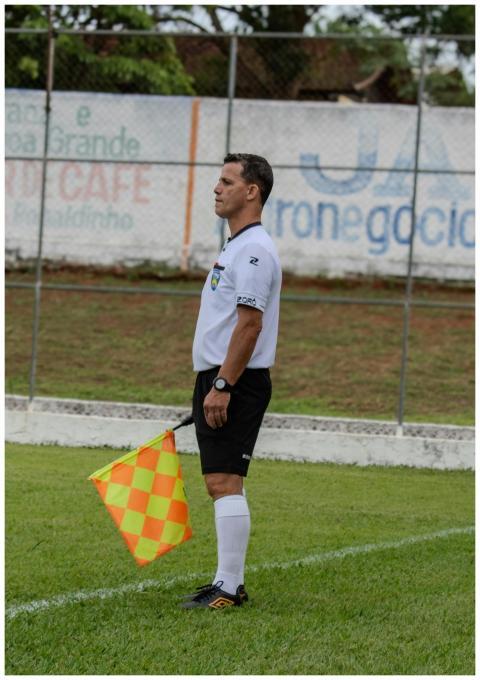 Soccer assistant referee on the sideline holding a