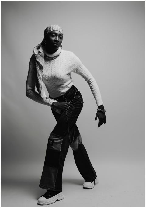 Black and white portrait of a woman in trendy stre