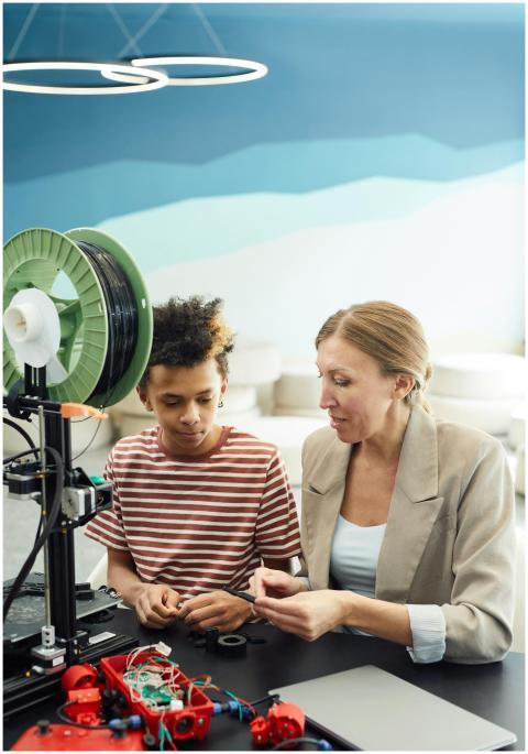 A child and adult engage in a learning session wit