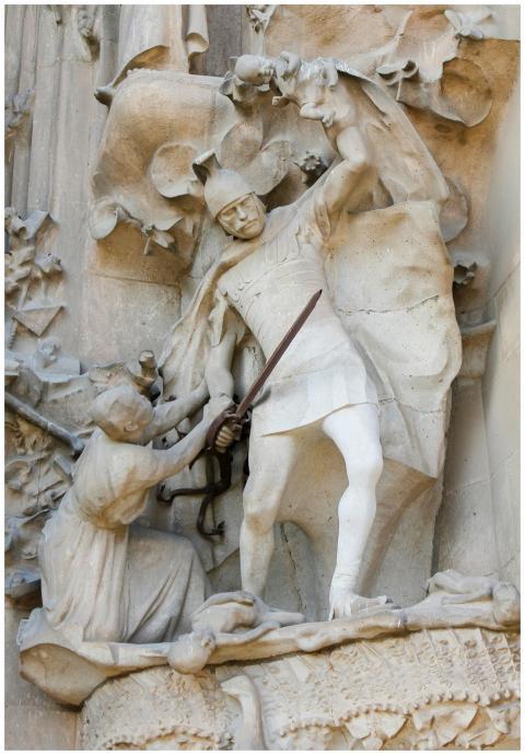 Intricate stone sculpture depicting warriors in a