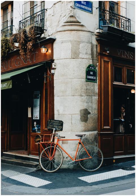 A quaint street scene in Paris featuring a vintage