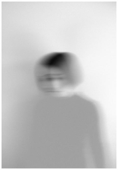 Artistic blurred grayscale portrait capturing moti