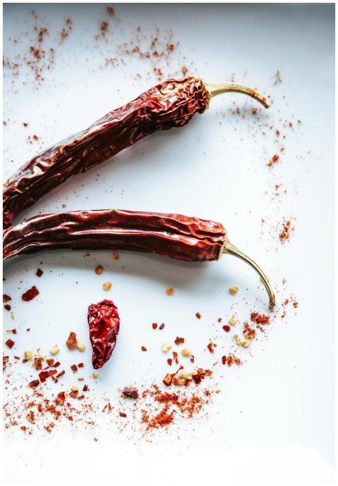 Vibrant image of dried chili peppers and spices on