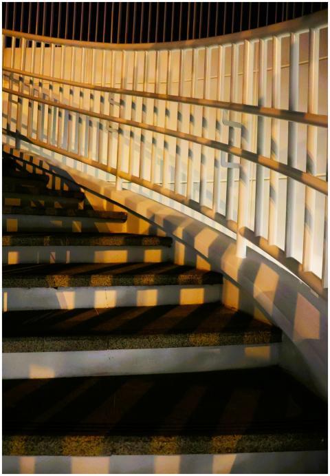 Artistic view of a curved staircase with dramatic