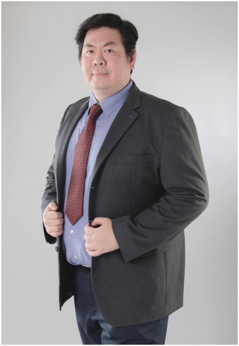 Asian man posing confidently in formal wear, suita