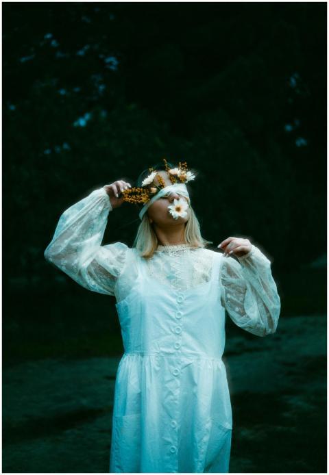 A mysterious portrait of a blindfolded woman in a