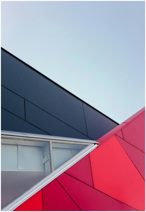 A low-angle view of a modern geometric building fa
