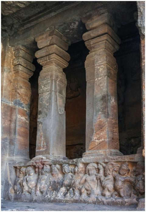 Intricately carved ancient rock-cut pillars in Bad