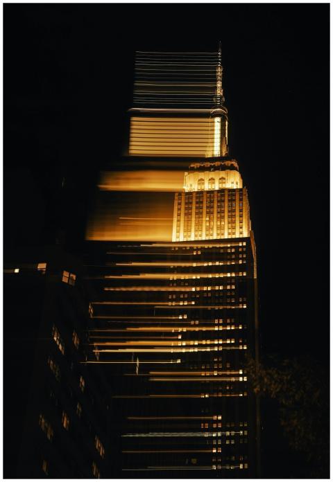 Abstract view of a skyscraper with golden light tr
