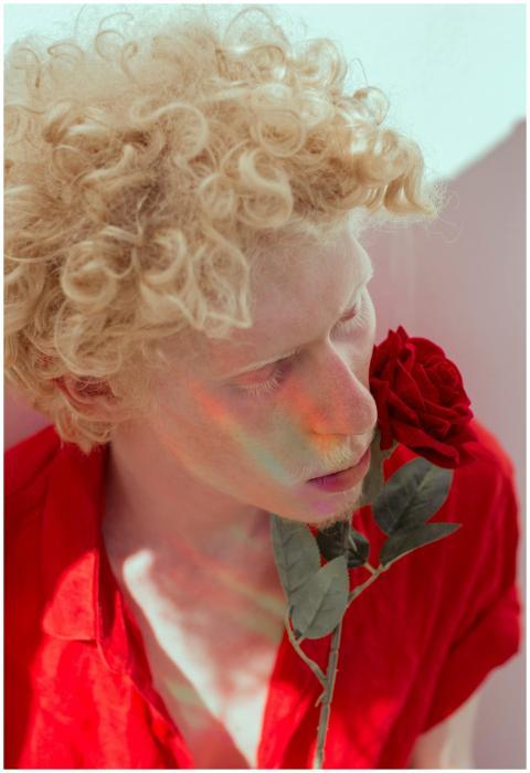 Artistic portrait of a person with curly blonde ha