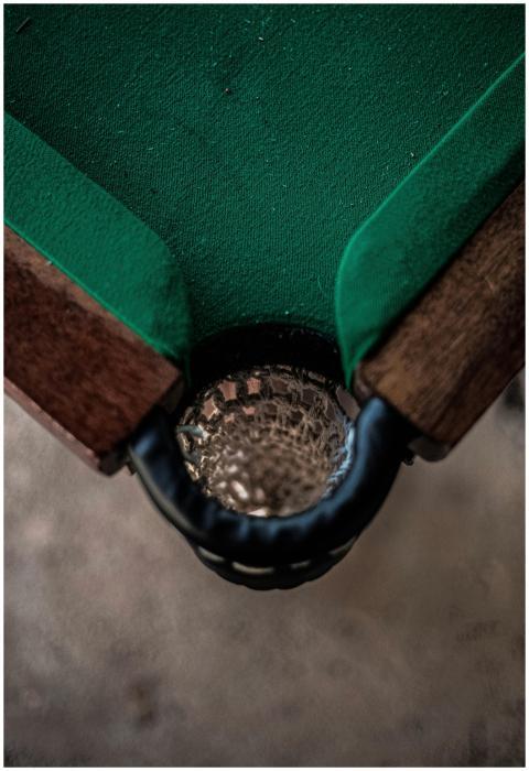 Detailed view of a billiard table's corner drop po