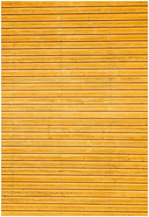 Close-up of yellow wooden plank wall with horizont