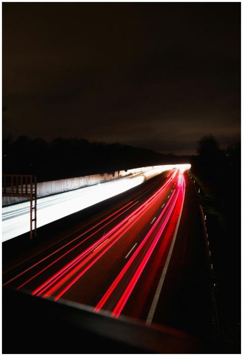 Highway at night capturing red and white light tra