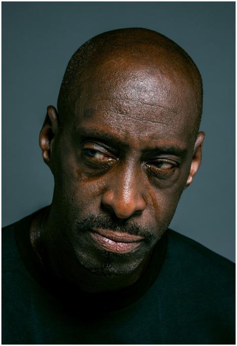 Close-up portrait of a man with a serious, reflect