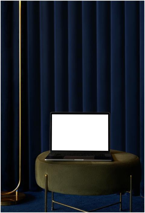 Modern laptop with blank screen on chic table agai