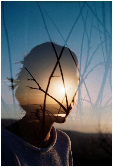 Artistic double exposure of a woman's silhouette w