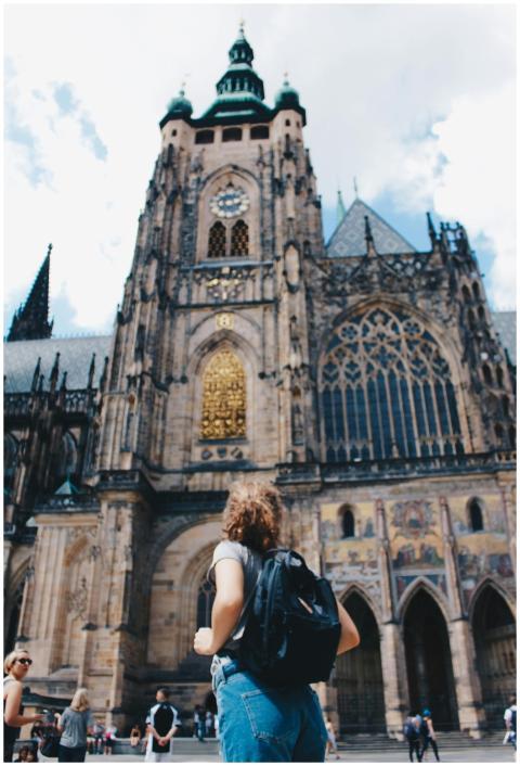 Traveler admires the stunning facade of St. Vitus
