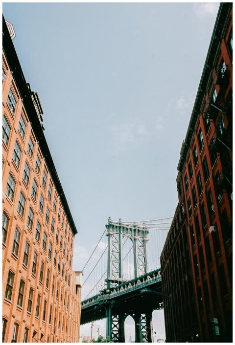 Manhattan Bridge framed by urban architecture in N