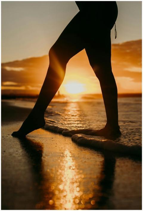 A captivating silhouette of a woman standing at th