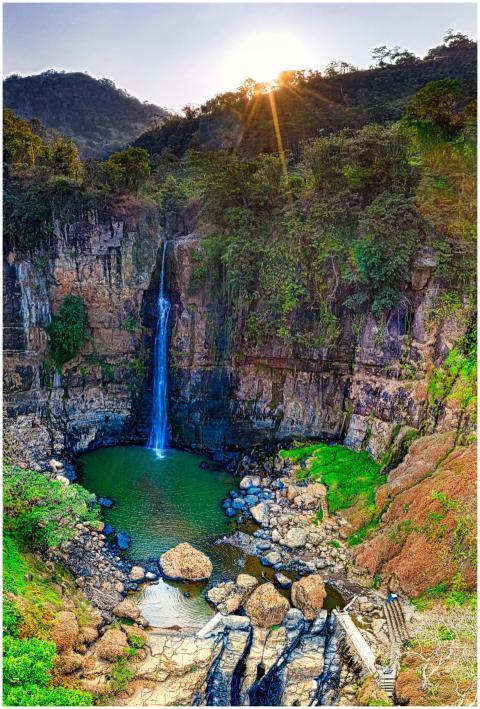 Breathtaking view of a tall waterfall in West Java
