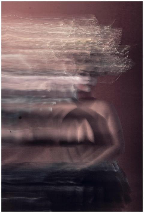 Surreal blurred portrait of a woman with dynamic m