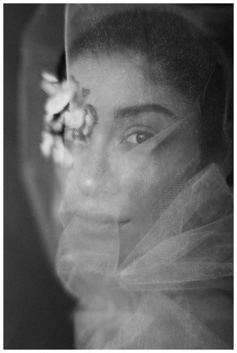 Black and white portrait of a woman with a veil an