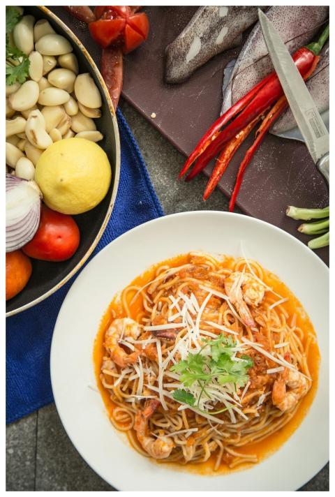 Mouth-watering shrimp pasta garnished with fresh h
