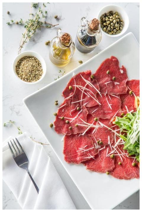 Delicious beef carpaccio with capers, olive oil, a