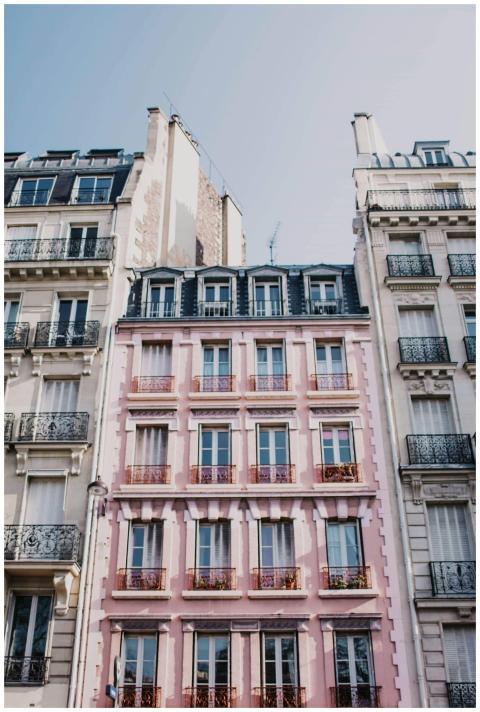 Charming pink building facade in urban cityscape,