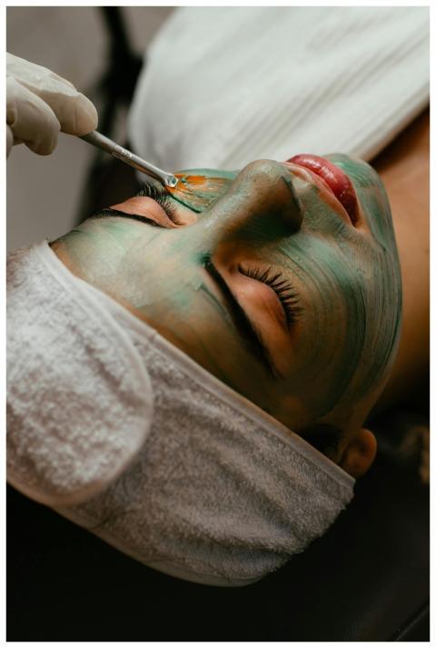 Woman receiving a soothing facial mask treatment a