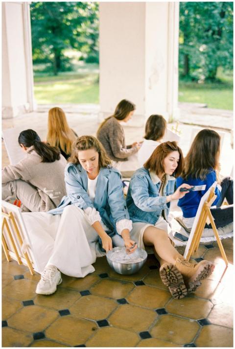 Women engaged in a plein air painting workshop, ca