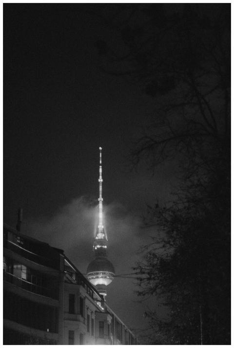 Black and white photo of Berlin's TV Tower illumin