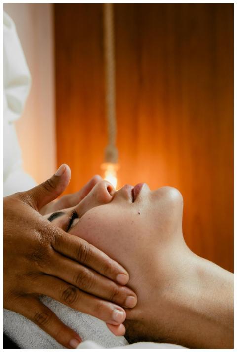 A peaceful facial massage in a warm spa environmen