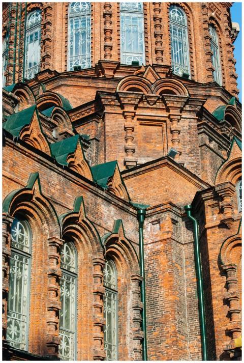 Close-up of a red brick Gothic-style building with