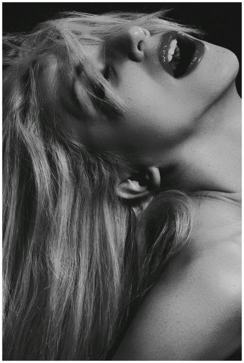 Dramatic black and white close-up portrait of a wo