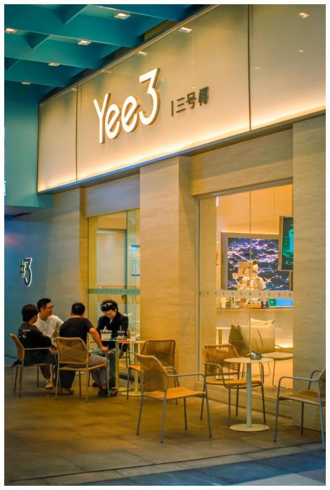 Casual outdoor dining at a modern cafe with illumi