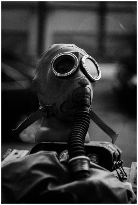 Grayscale image showcasing a vintage gas mask on d