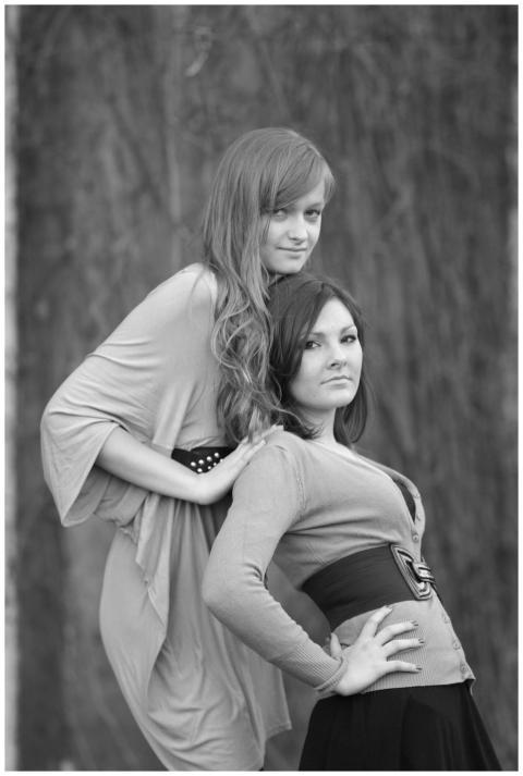 Stylish black and white portrait of two women outd