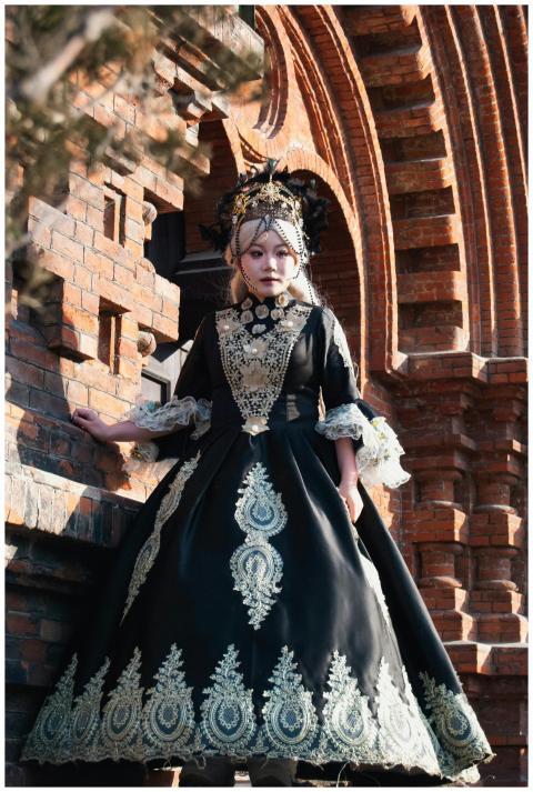 Elegant Victorian-style woman in gothic dress stan
