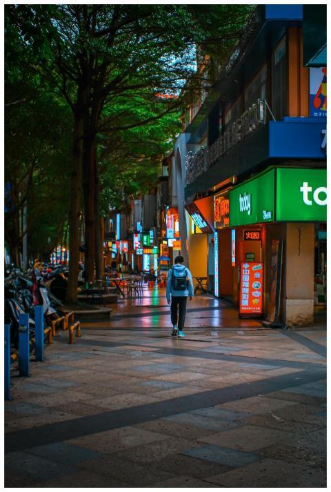 A vibrant urban street scene at night with colorfu